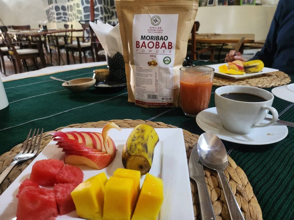 Breakfast with fresh fruit and baobab
